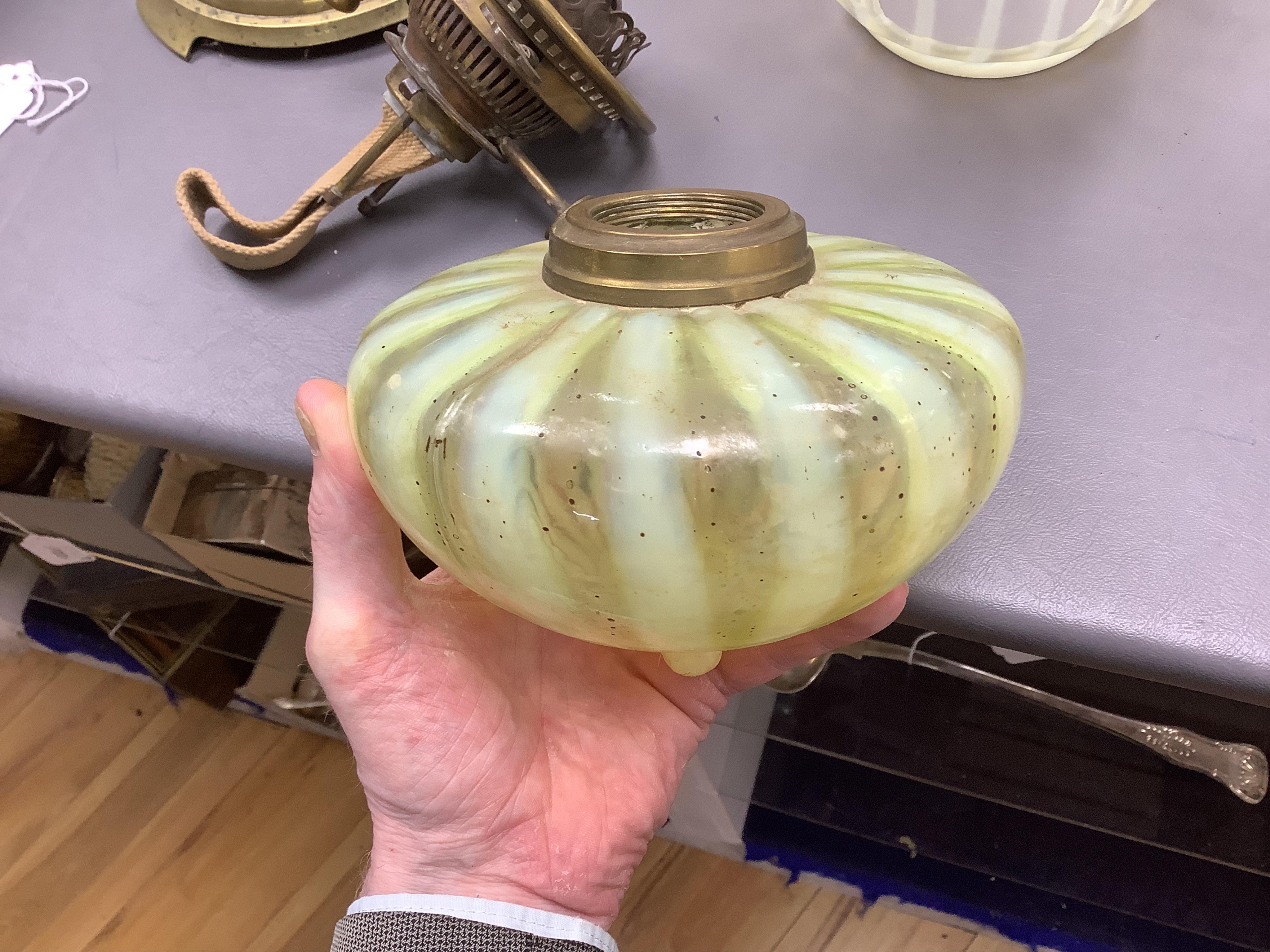 An Edwardian vaseline glass and brass oil lamp and shade, 56cm high